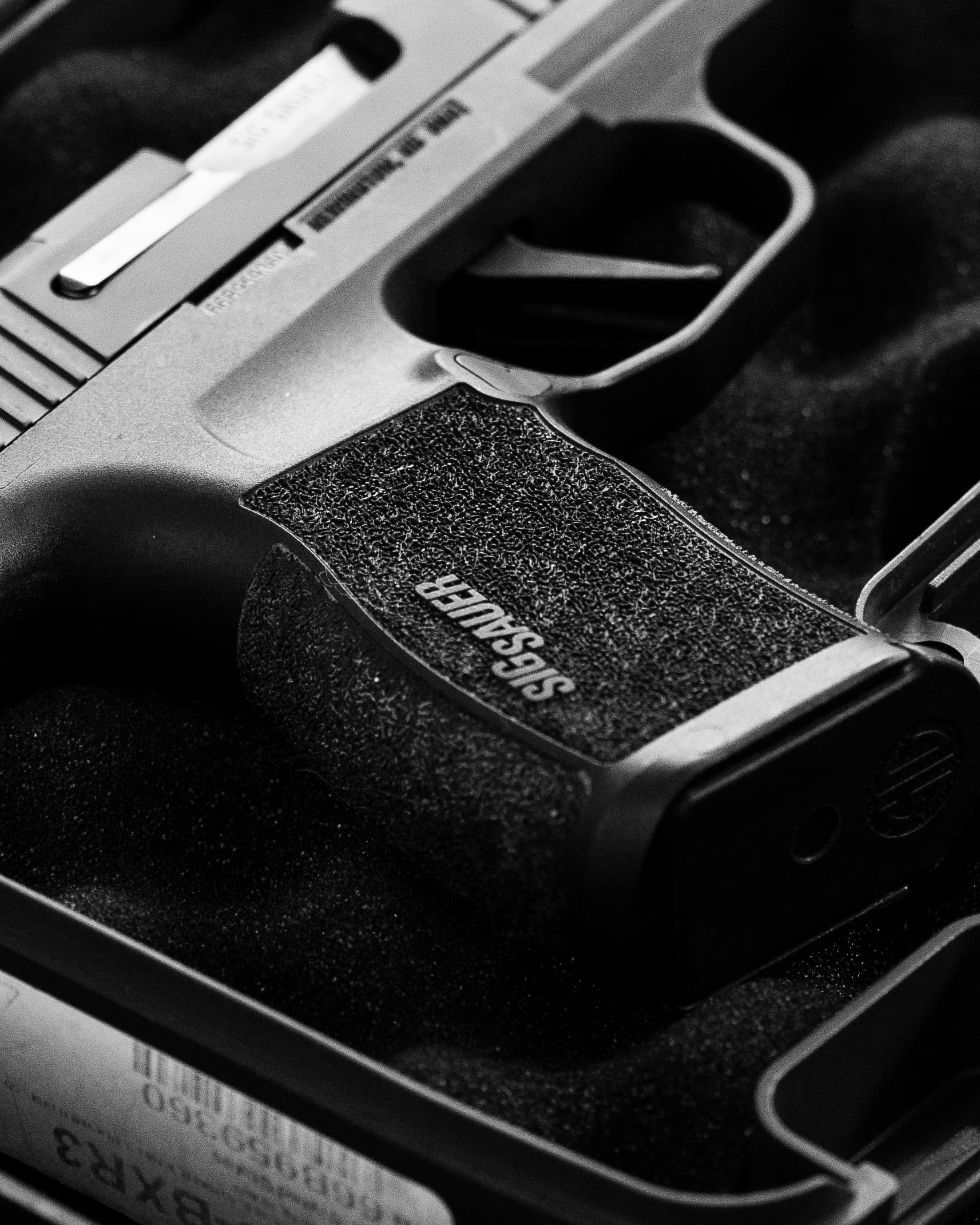 Handgun on a dark surface — shooting sport